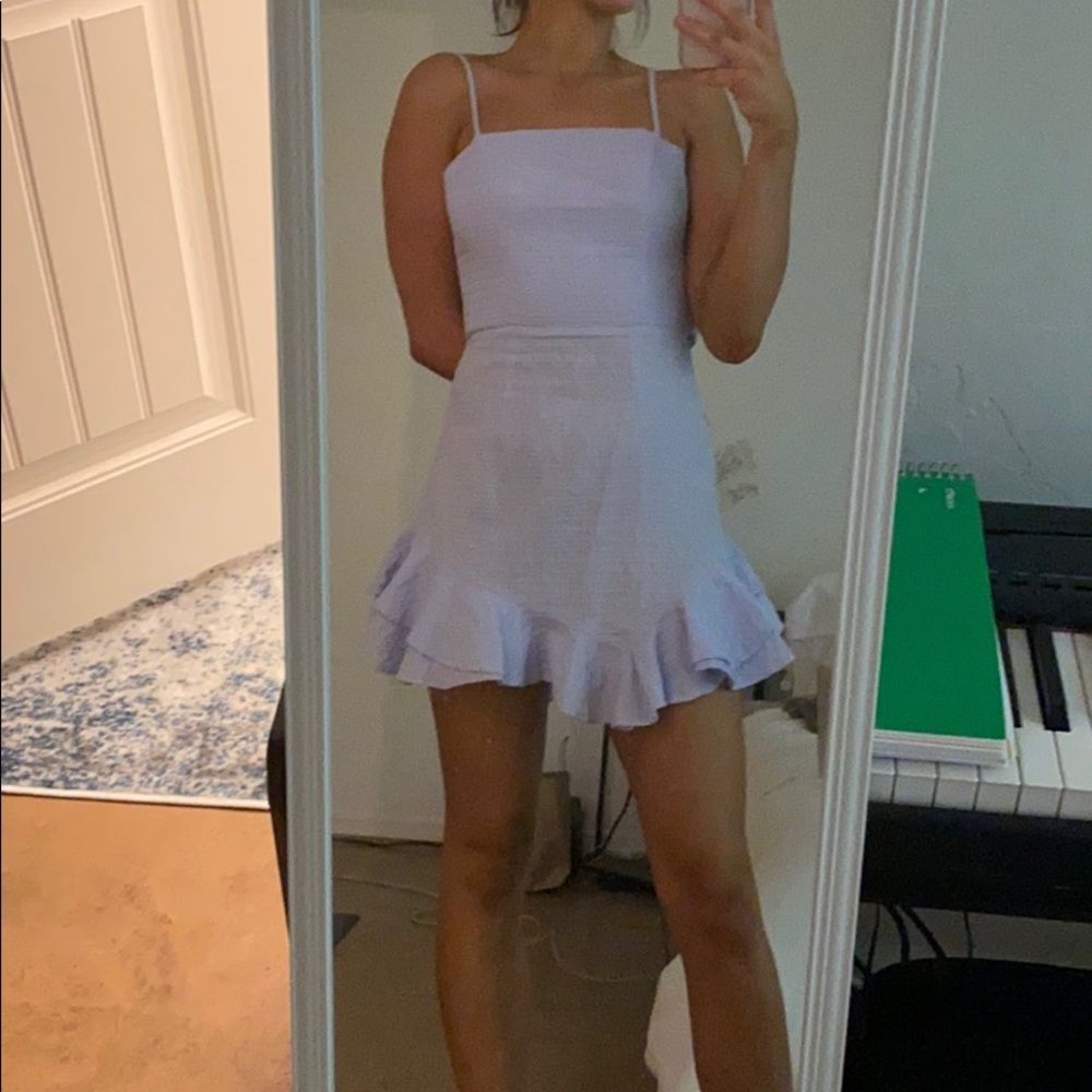 A light blue tie in the back dress